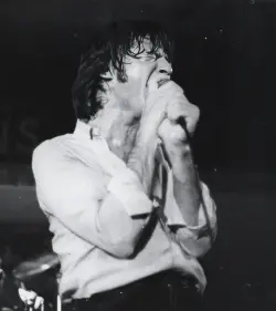 Young Joe Cerisano singing on stage