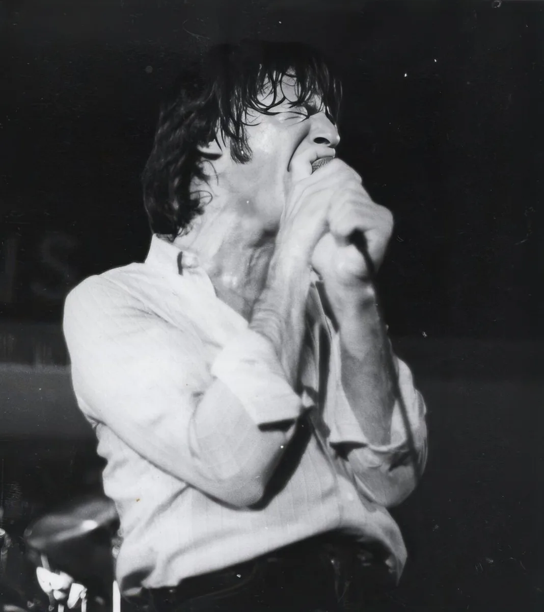 Young Joe Cerisano singing on stage