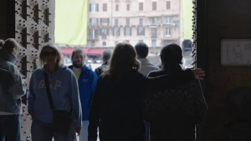 Joe entering an Italian street doorway
